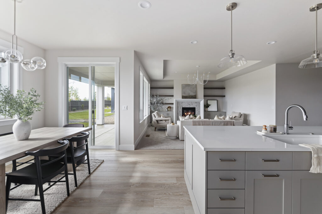 Open-concept kitchen, dining, and great room in a move-in ready home in Idaho by Alturas Homes
