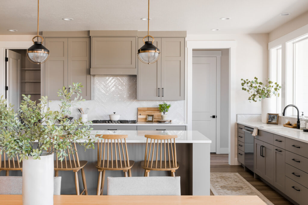 Interior view of a Pinnacle home kitchen, featuring spacious layout, modern cabinetry, and high-end finishes.