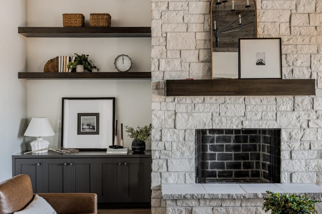 Detailed view of a stone fireplace in a home in Osprey Meadows by Alturas Homes at Tamarack Resort, Idaho showcasing luxury mountain living.
