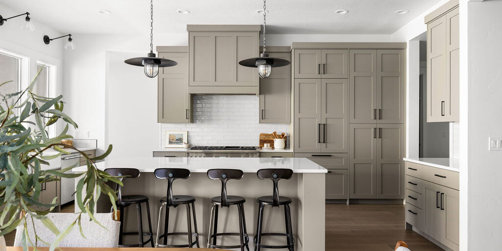 Kitchen featuring gorgeous taupe cabinets in the Clearwater floor plan by Alturas Homes at 11179 N Elk Ridge Way in The Highlands at Cartwright Ranch, Boise, Idaho