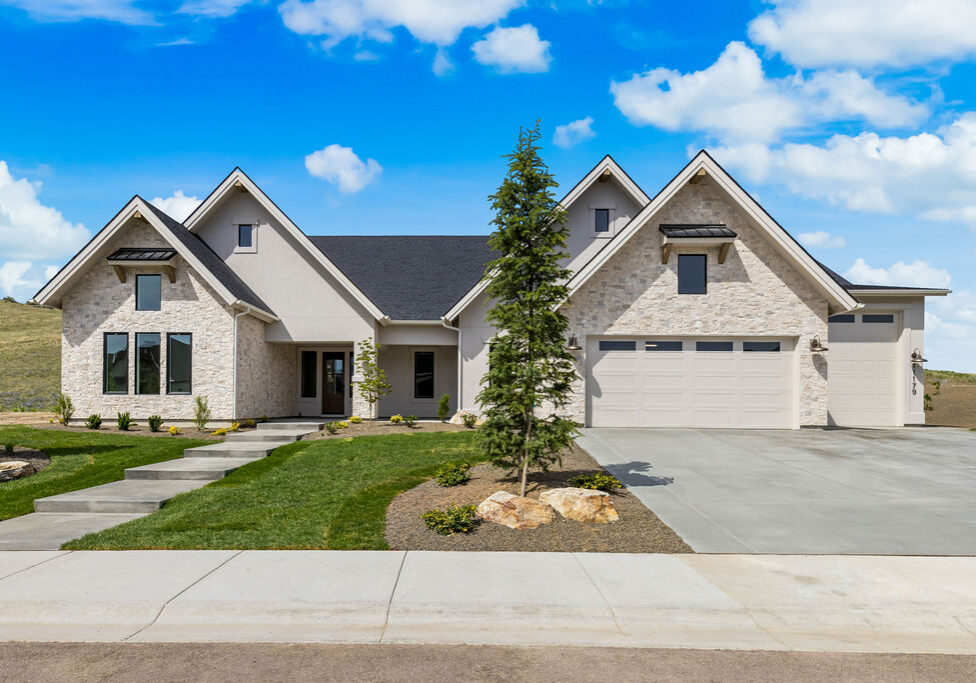 Front exterior of the Clearwater by Alturas Homes at 11179 N Elk Ridge Way in The Highlands at Cartwright Ranch