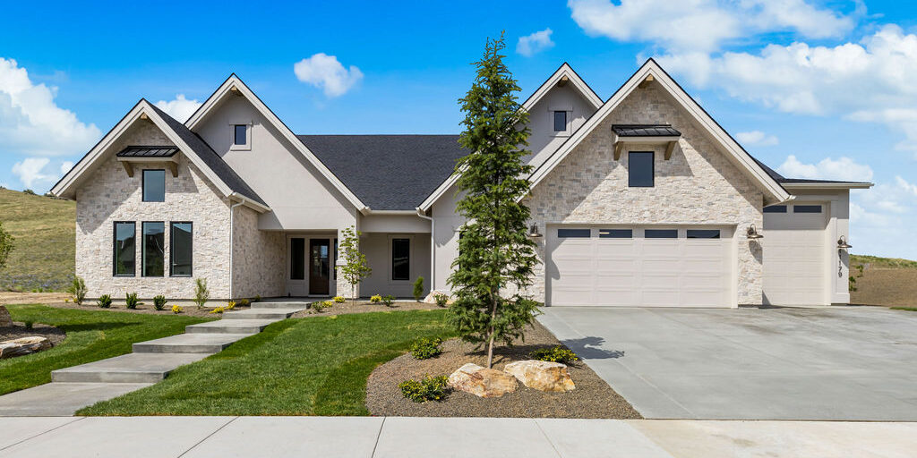 Front exterior of the Clearwater by Alturas Homes at 11179 N Elk Ridge Way in The Highlands at Cartwright Ranch